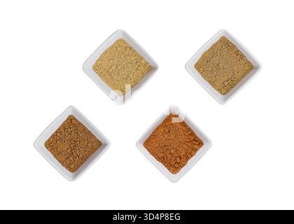 Food, Various Indian Spices in Small White Bowls on white background Stock Photo
