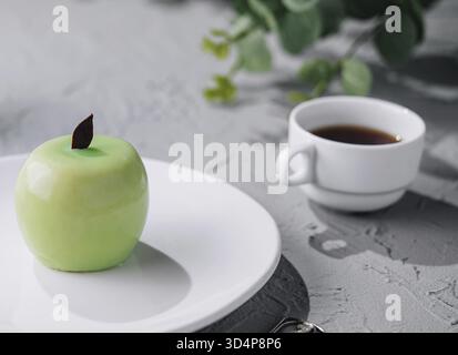 Food, Apple shaped mousse cake and tea Stock Photo