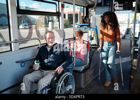 Diverse passengers using public transport with disabilities Stock Photo