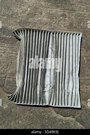 A dirty and destroyed car air conditioning filter Stock Photo