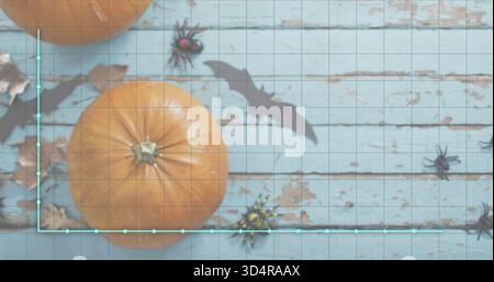 Showing large orange pumpkin sitting on worn planks with paper bats, spiders and cyan chart overlay Stock Photo