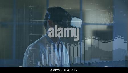 Exploring man in white collared shirt wearing VR headset manipulating holographic charts in dim lab Stock Photo