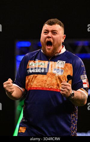 Josh Rock celebrates winning against Jonny Clayton during the 2026 ...