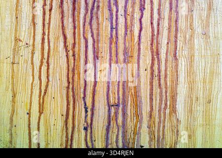Traces of the corrosive stains on a yellow metal plate Stock Photo
