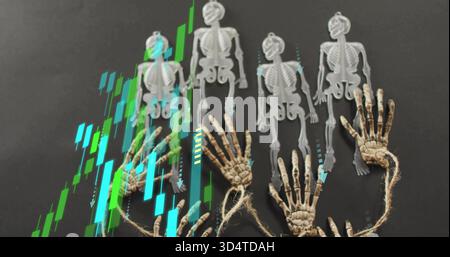 Displaying five plastic skeletons aligned on matte table, with tied hands and neon chart overlay Stock Photo
