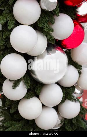New Year's decorations on the tree: white balls on the branches of the tree. Part of the frame Stock Photo