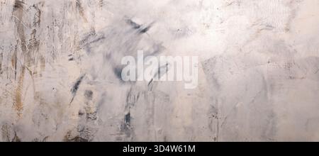Close-up of a weathered concrete wall with light gray and beige tones, featuring artistic texture. Ideal for backgrounds, design projects, or modern i Stock Photo