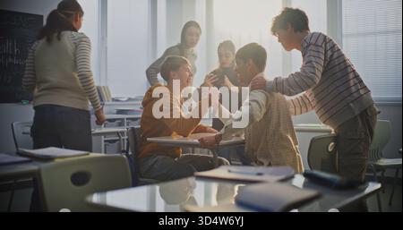 Students Engage in Friendly Arm Wrestling Match During Free Time, Expressing Emotion and Laughter. Concept of Camaraderie, Emotional Intelligence, and Peer Bonding in Modern Education. Static Shot. Stock Photo