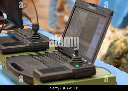 An army laptop with two joysticks is used as a control system for military equipment Stock Photo