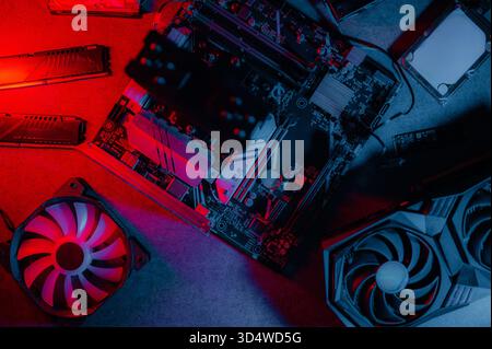 Graphics card and other computer hardware on grey textured table, flat lay. Space for text. Stock Photo