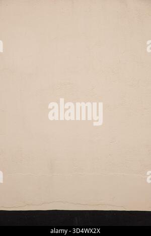 Yellow painted concrete wall vertical Stock Photo