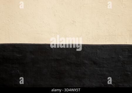 Two tone wall background yellow and black with copy space Stock Photo