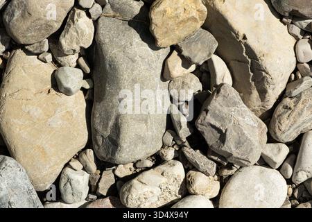 Smooth Natural Stones near Mountain River. Eco Friendly Background with Organic Texture Stock Photo