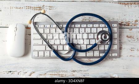 Stethoscope on a Computer Keyboard and Mouse: Telemedicine, Digital Health Records, and Modern Medical Technology Stock Photo