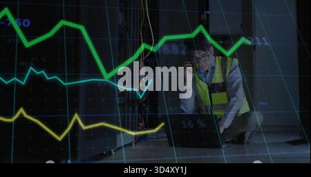 Inspecting man wearing hi-vis vest checking laptop and cables, phoning in server room, copy space Stock Photo