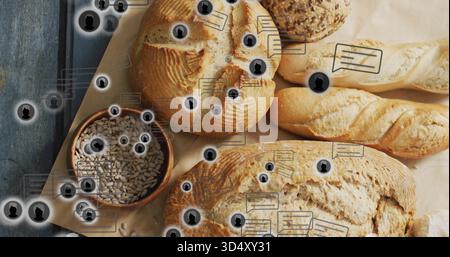Displaying assortment of artisan breads on parchment at studio table, with seed bowl overlays Stock Photo