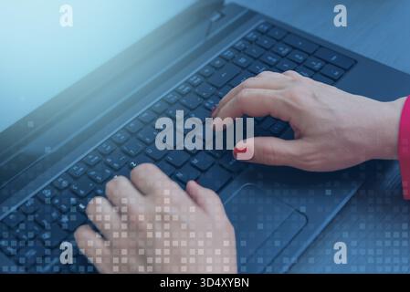 Hands typing on laptop keyboard with digital overlay, concept of cyber technology, data processing, online communication, and secure digital connectio Stock Photo