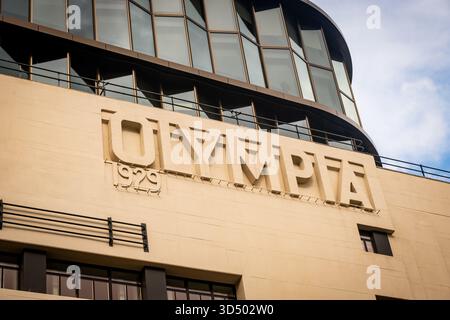 LONDON - OCTOBER 21, 2025: Kensington Olympia 1925 Facade with Modern Glass Extension, Art Deco Architecture Stock Photo