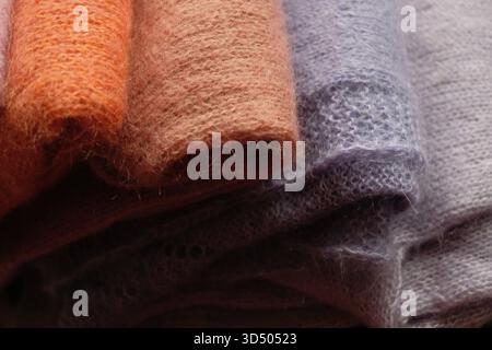 knitted sweaters in different colours Stock Photo