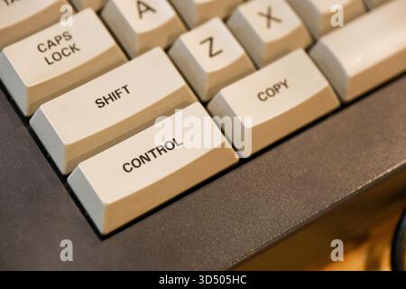 A compact keyboard places shift, control and copy at the front edge with tall caps and clean legends, the shallow depth draws focus to the corner whil Stock Photo