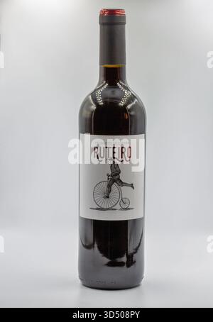 Kyiv, Ukraine - August 16, 2024: Ruteiro Spanish red wine bottle featuring vintage penny-farthing bicycle illustration on white label. Dark glass bott Stock Photo