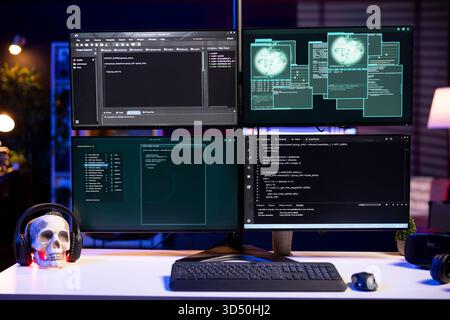 Hacking code scripts running on computer system monitors attacking firewalls. Programming language malware software shown on PC screen used by cyber criminals to breach security Stock Photo