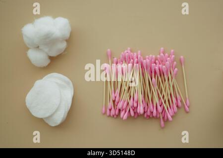 Cotton balls and swabs arranged on a plain surface Stock Photo