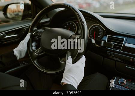 Middle Aged Man Driving Luxury Car Wearing Gloves Stock Photo