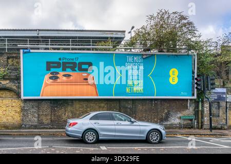 An advertising poster for the iPhone 17 Pro and EE mobile network. Stock Photo