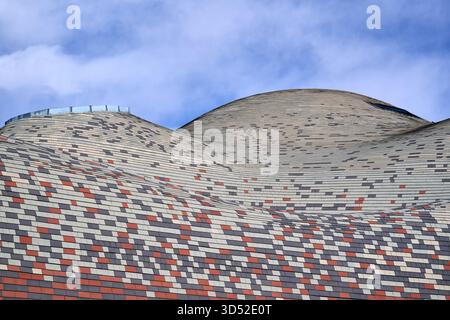 Datong Grand Theater roof wave pattern close-up textured surface, undulating waves brick tiles, multi-toned geometric arrangement Stock Photo