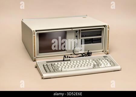 Pavia, Lombardy, Italy - March 13, 2025: IBM Portable PC 5155 Model 68, a 1984 suitcase-style computer with two 5.25 inch floppy drives.. Show at Ctrl Stock Photo