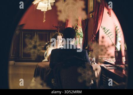 A winter wedding, the groom in a tuxedo and the bride in a white wedding dress Stock Photo