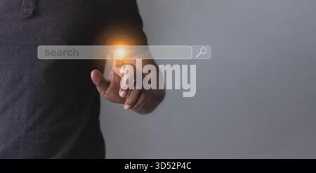 Young man hand touching to search bar, Search job Stock Photo