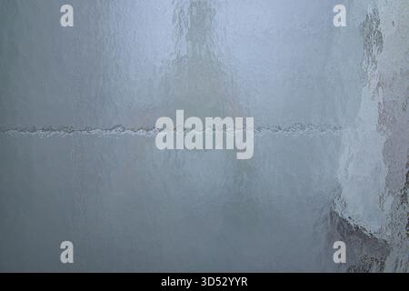 Translucent Glass Textured Textured frosted glass surface with soft warm backlighting and an ...