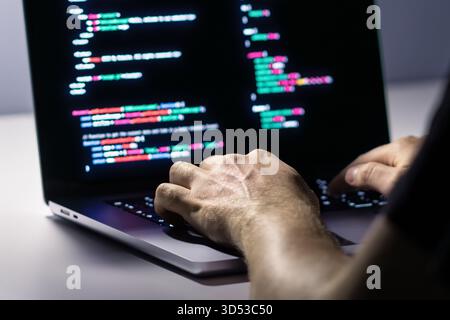 Cyber attack or malware hacker. Cyberattack to computer data. Cybersecurity. Ransomware code. Security software against spyware. Fraud, virus. Stock Photo