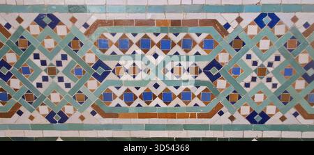 Decorative zellij mosaic creating a traditional islamic geometric pattern with colorful tiles Stock Photo