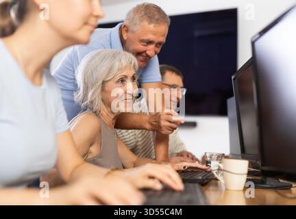 Group of older people studying on computer course Stock Photo