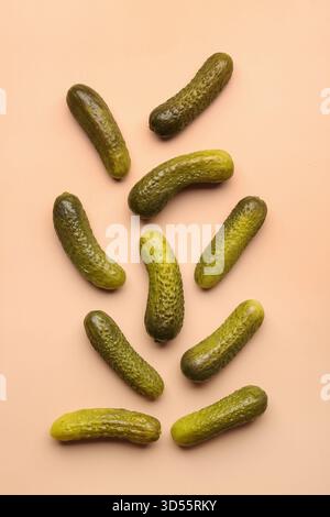 Pickled cucumbers on orange background Stock Photo