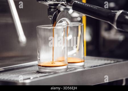 Close-Up View of Espresso Extraction Process in Modern Coffee Machine at Cafe Stock Photo