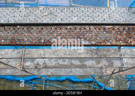 High angle view of a Scaffolding structure providing temporary access with platforms and protective netting Stock Photo