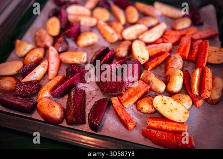 Freshly made homemade colorful healthy organic oven-roasted root vegetables including beets, carrots and potatoes Stock Photo