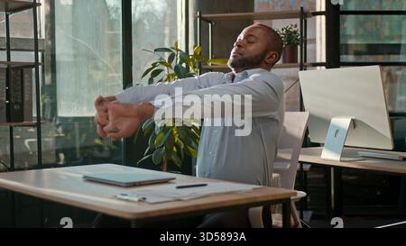 Successful businessman African American business man finish computer work end online project close laptop job done pause freedom break relaxing in Stock Photo