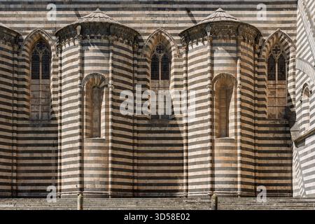 Italy - Orvieto - Duomo di Orvieto - Close up of the rear apse showing striped marble arches and windows Stock Photo