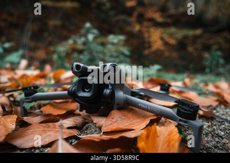 Antalya, Turkey - November 5, 2025: Close-up of DJI Mini 5 Pro drone on autumn leaves Stock Photo