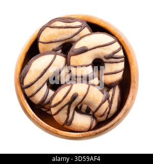 Crescent shaped shortbread cookies, in a wooden bowl. Crumbly biscuits, made from high ratio of butter, along with sugar and flour. Stock Photo