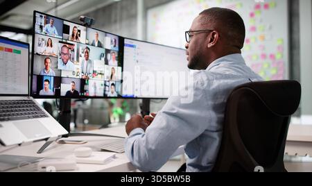 Young Black Man Using Laptop For Online Video Interviews And Meetings. Stock Photo