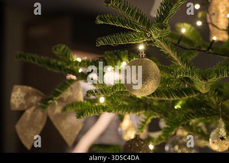 Beautiful traditional Christmas tree decoration with blured lights on the background Stock Photo