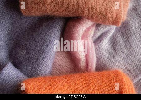 knitted sweaters in different colours Stock Photo
