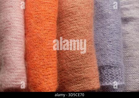 knitted sweaters in different colours Stock Photo
