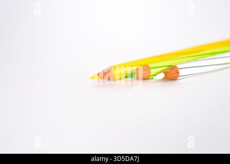 Multi colour pencils on white background Stock Photo